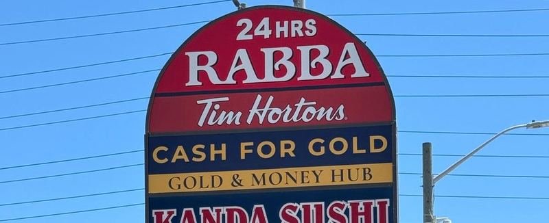 Gold & Money Hub on the tall plaza sign on Hurontario St, alongside Rabba and Tim Hortons
